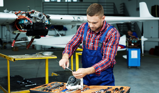 Aviation technician working on a plane